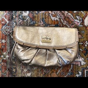 Coach clutch with handle strap